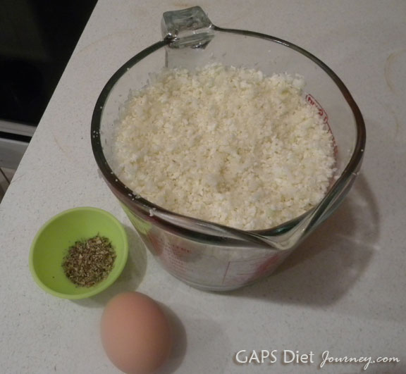 Three ingredients: Riced Cauliflower, oregano, egg